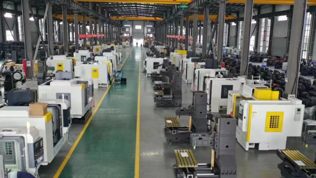Handemo CNC workshop floor with machining centers arranged along the aisle