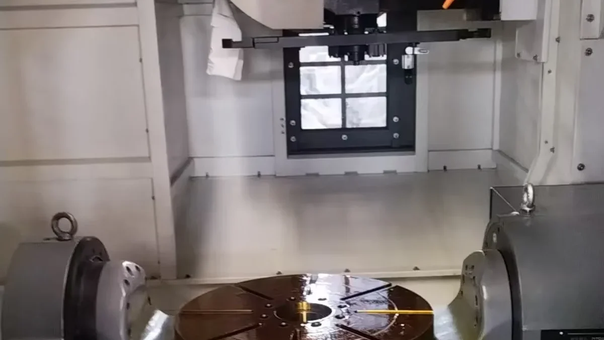 Trunnion rotary table inside a five-axis machining centre at Handemo CNC