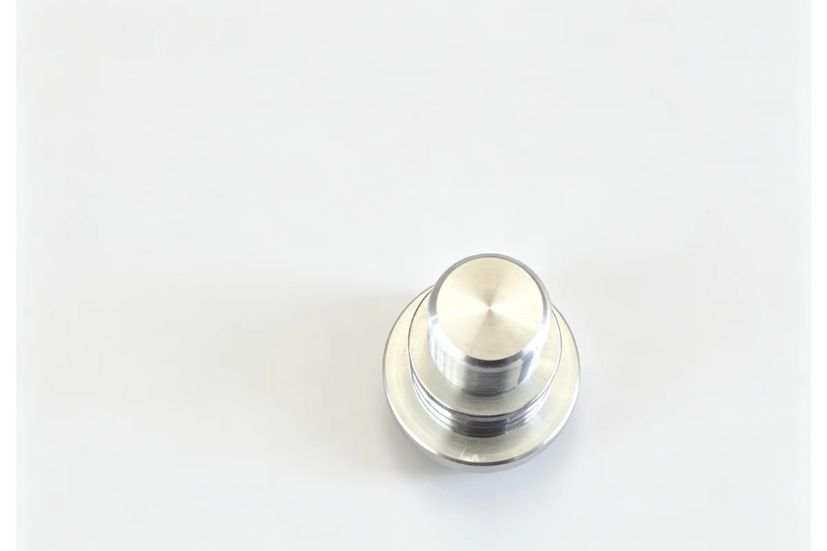 Machined ball pin and stepped spindle pin for a steering joint