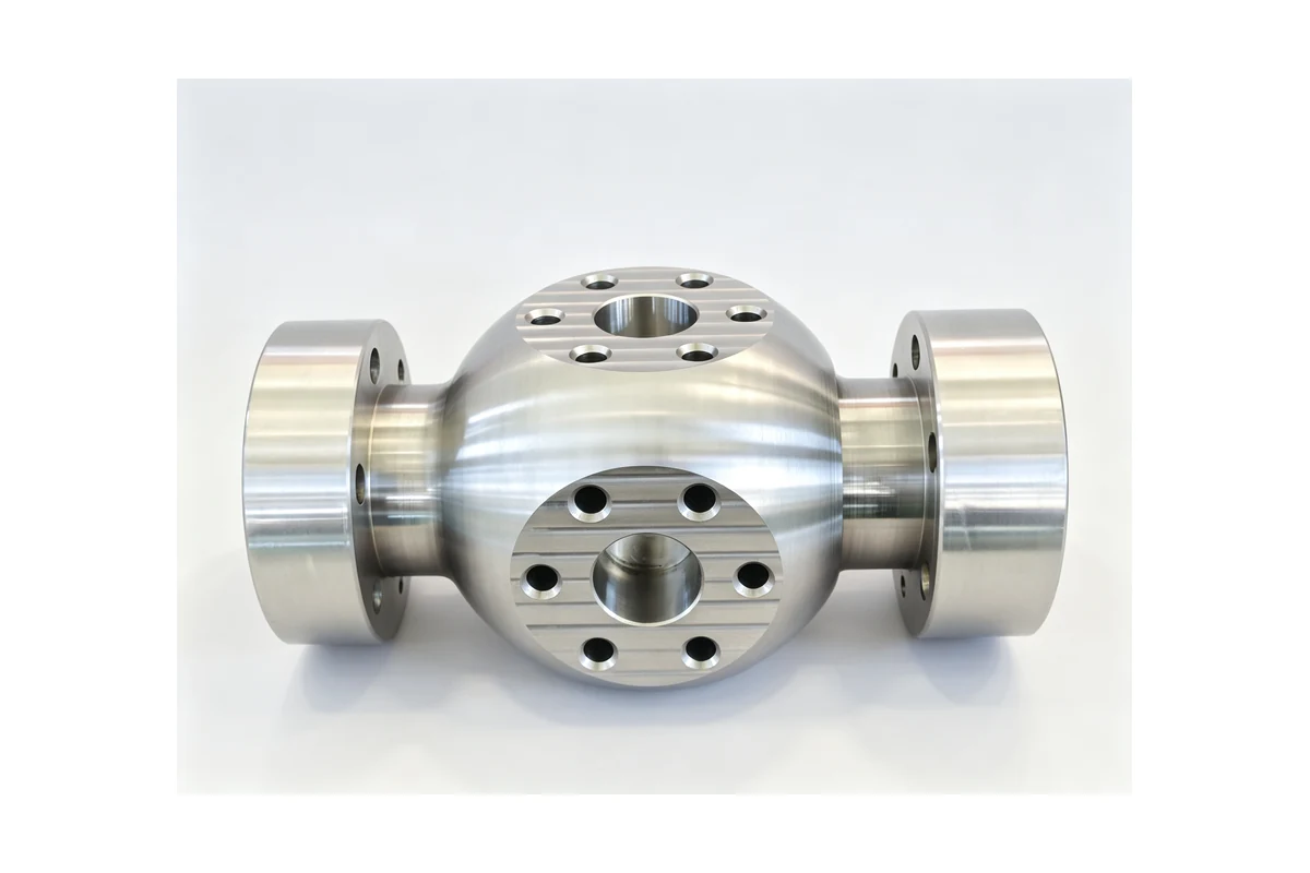Machined stainless valve body with opposed bores and a flat sealing face
