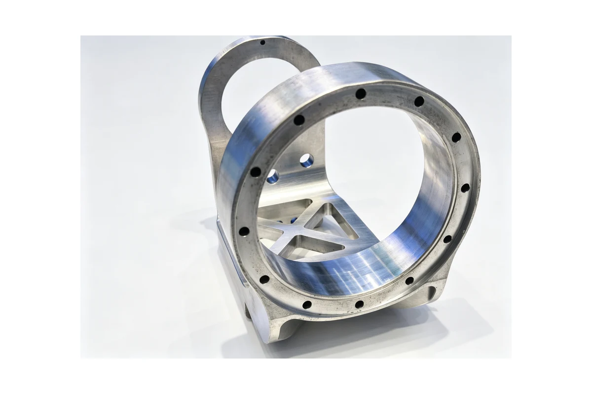 Machined flanged housing with a bolted mounting flange and a large central bore