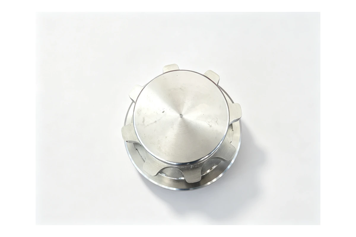 Steel hub with a ring of external coupling teeth, a stepped body and a machined bore, shown on a white background