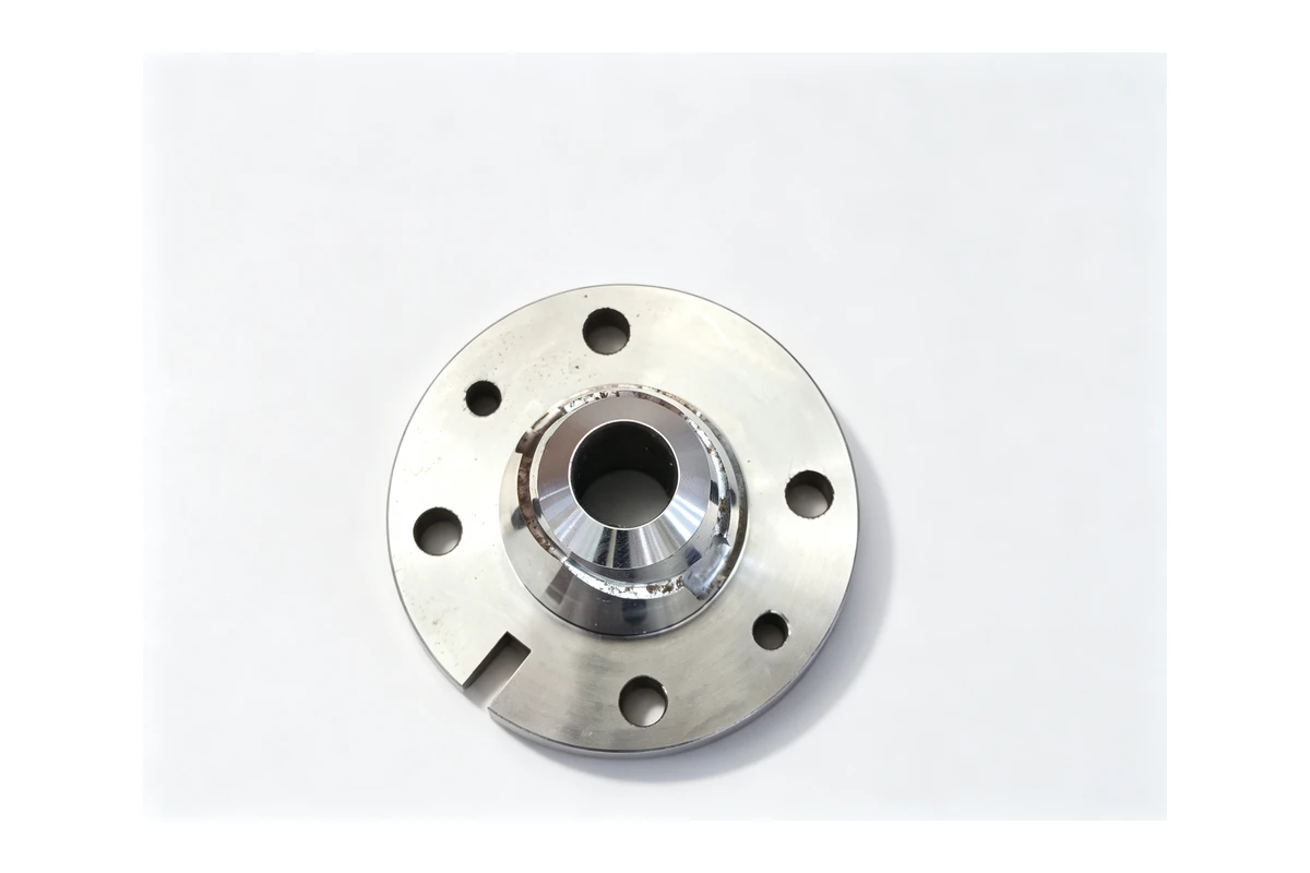 Machined steel hub with a raised boss, a bolt circle and a cut keyway, shown on a white background