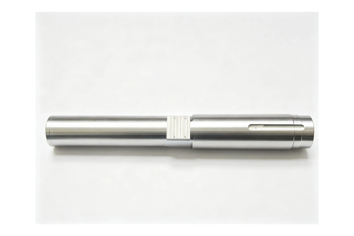 Long stepped steel shaft with several turned diameters, a milled flat and a threaded end, of the type used as a reducer input shaft